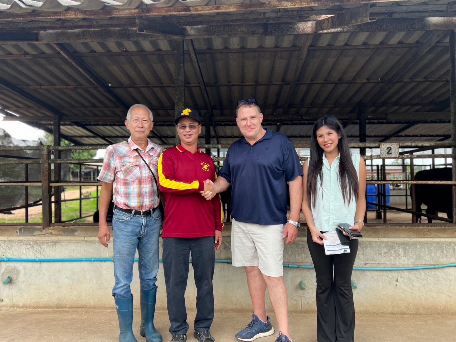 Ben and Ploy Cunningham with partner ranchers in Thailand